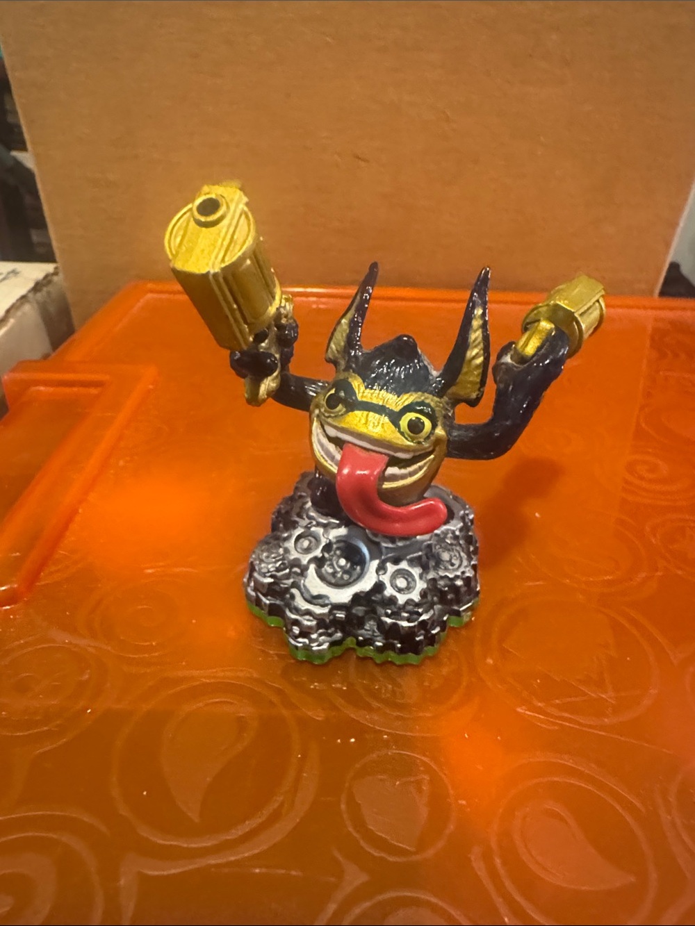 Blue and Gold Monster Figure with Red Tongue